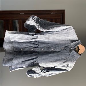 Collared button down shirt with ruffled bottom